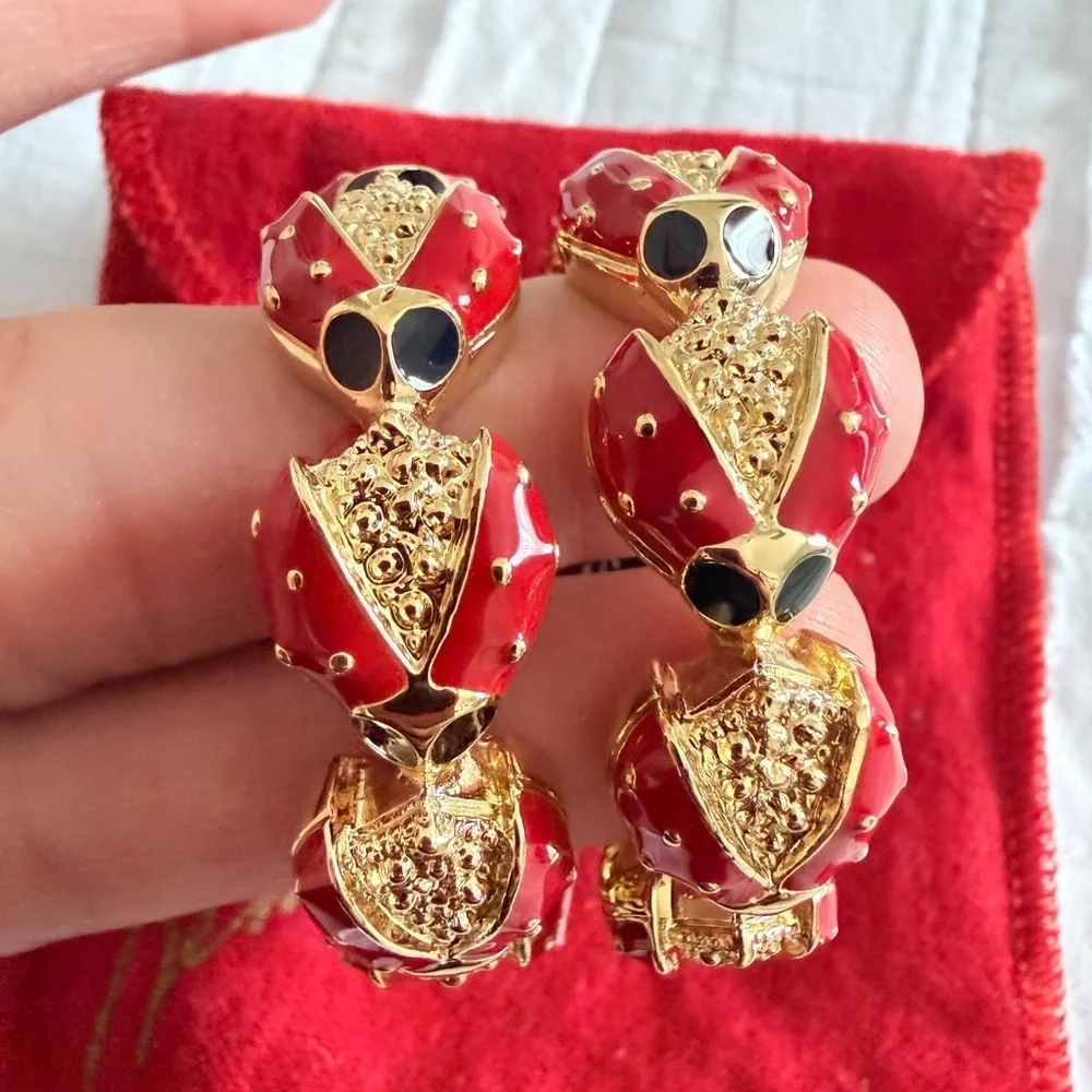 Kenneth Jay Lane Red and Gold napkins  Holders rings